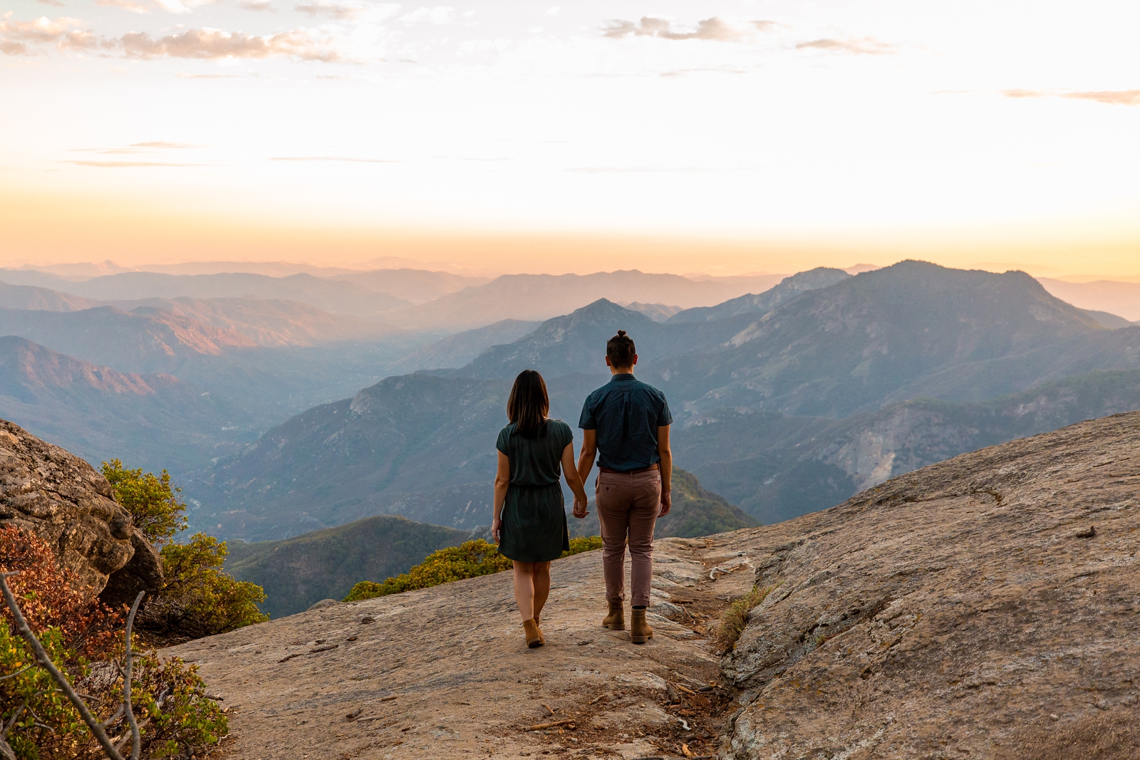 Engaged couple walking out to the cliff at their Sequoia National Park engagement session.