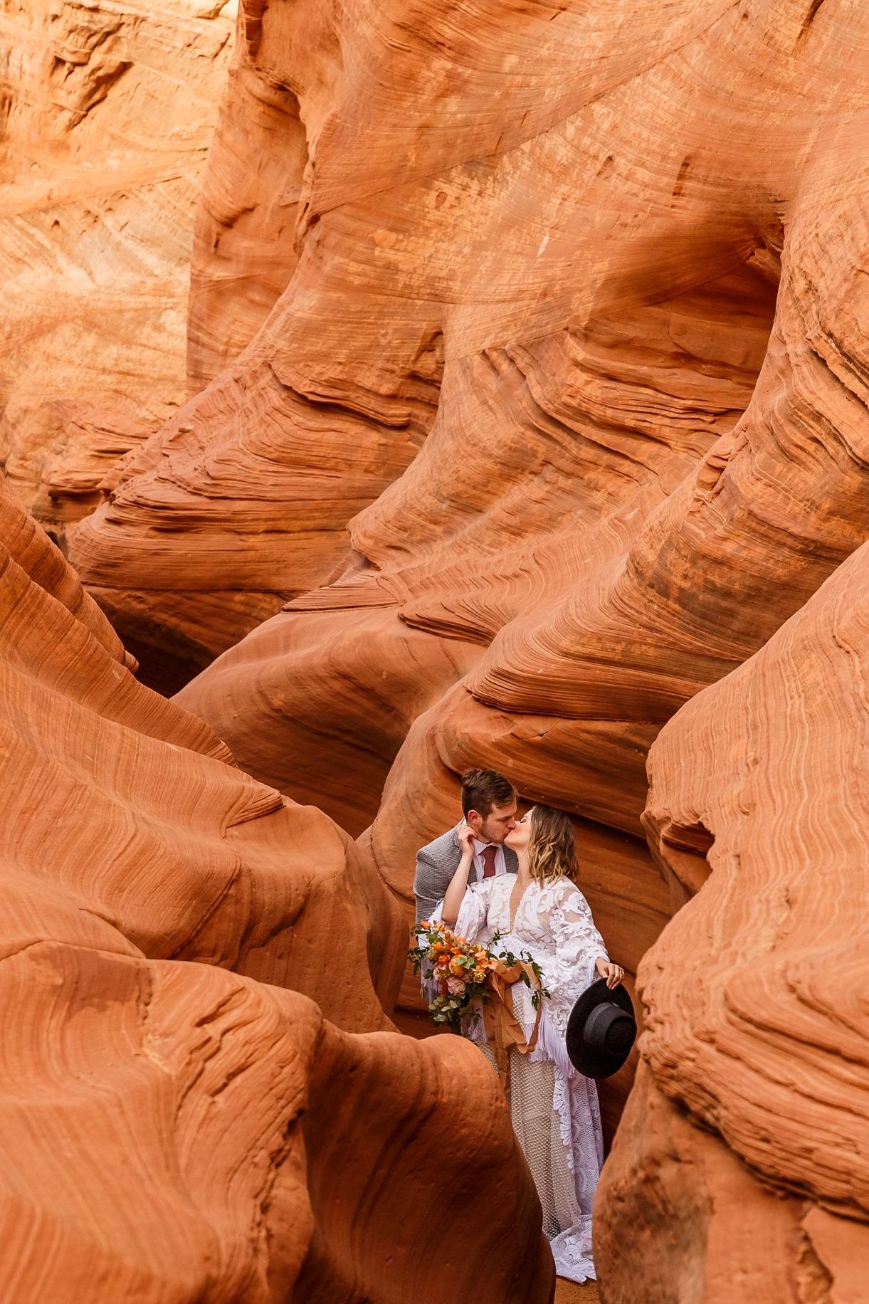 This boho couple traveled to Page Arizona for their slot canyon elopement at Waterholes Canyon