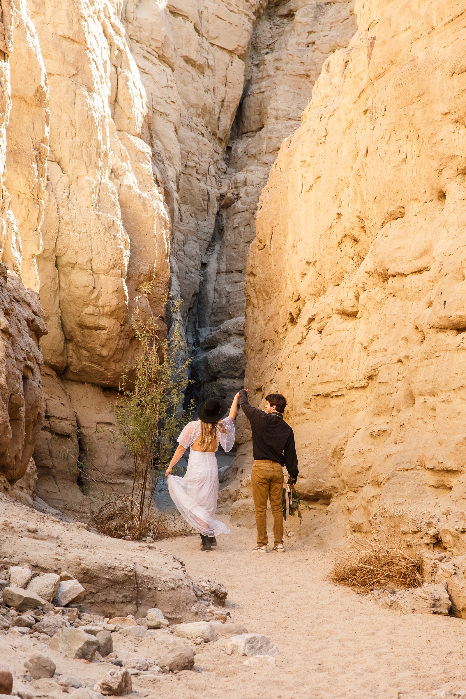 This couple dance at in a slot canyon during their scenic slot canyon Elopement session.