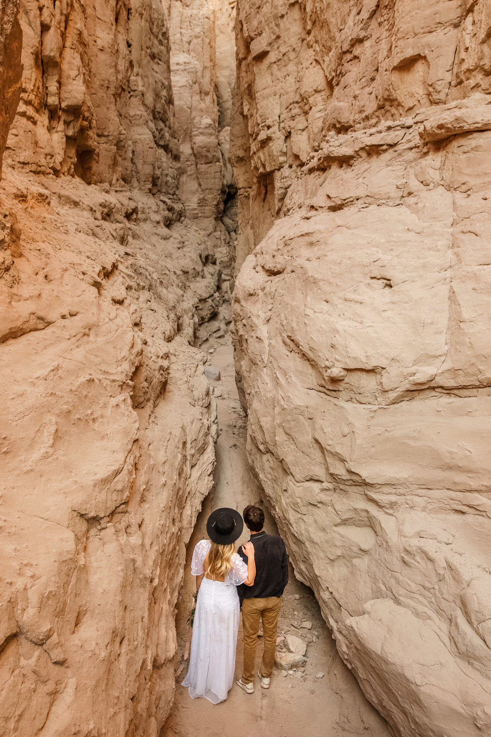 The Bride & Groom take a moment to enjoy their outdoor adventure slot canyon elopement.
