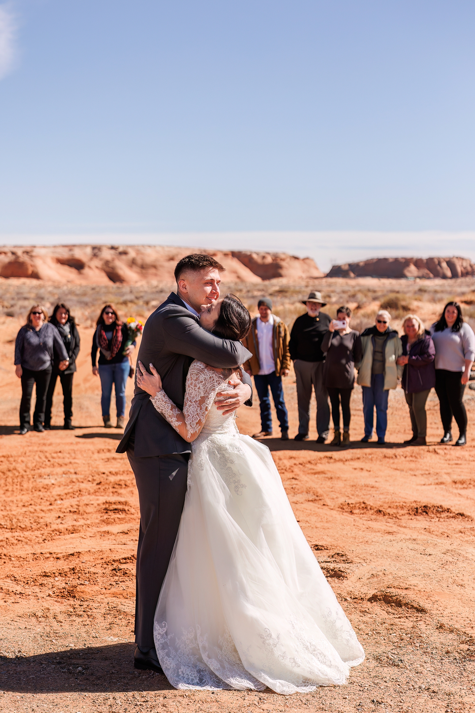 The happy couple embrace before their wonderful elopement in Arizona