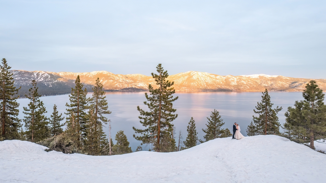photo of Lake Tahoe at winter time with the mountains in the distance