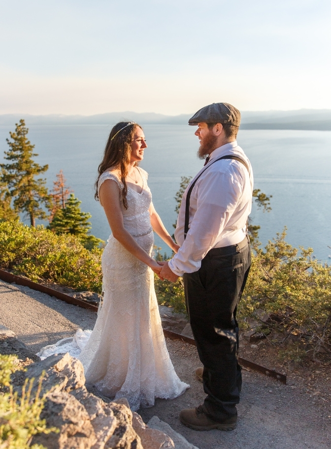 bride and groom holding hands and looking into each others eyes for the Lake Tahoe wedding