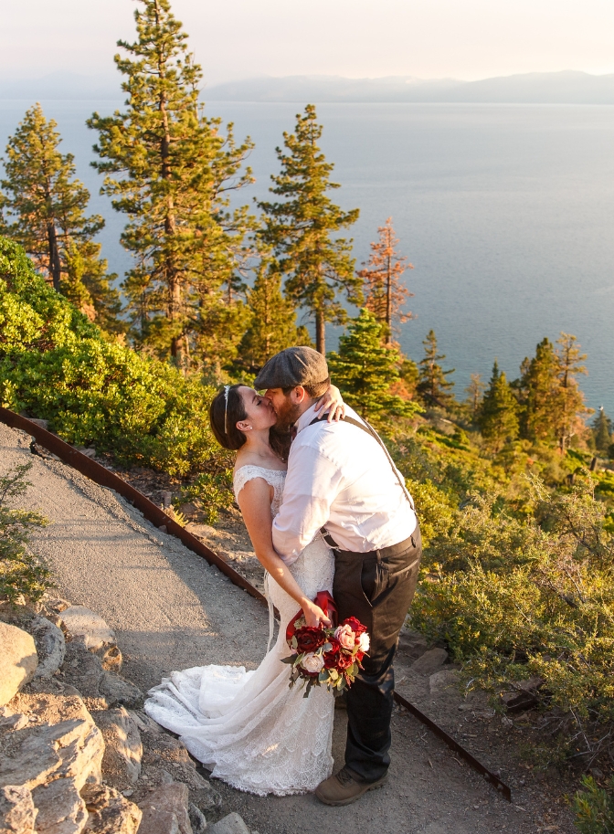 photo of bride and groom kissing with Lake Tahoe in the background
