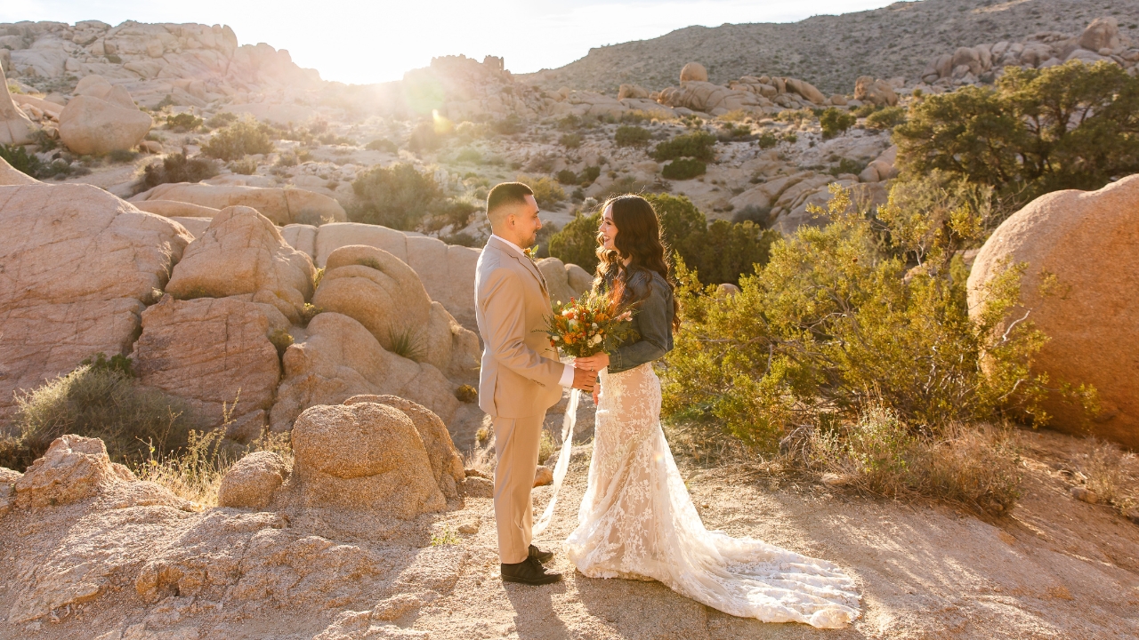 photo of bride and groom smiling at each other in Joshua Tree for their wedding