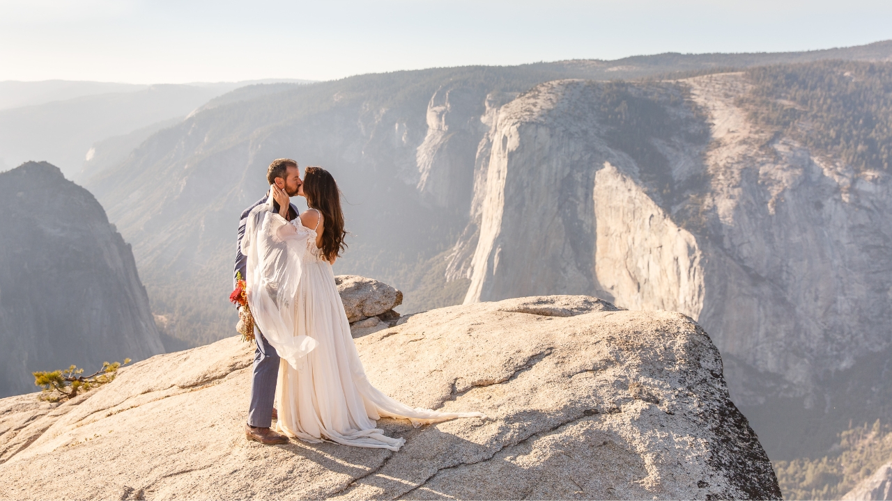 photo of bride and groom kissing at Glacier Point Amphitheater for their elopement