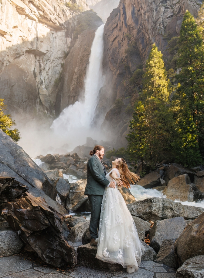 photo of bride and groom enjoying the waterfall at Yosemite for their elopement