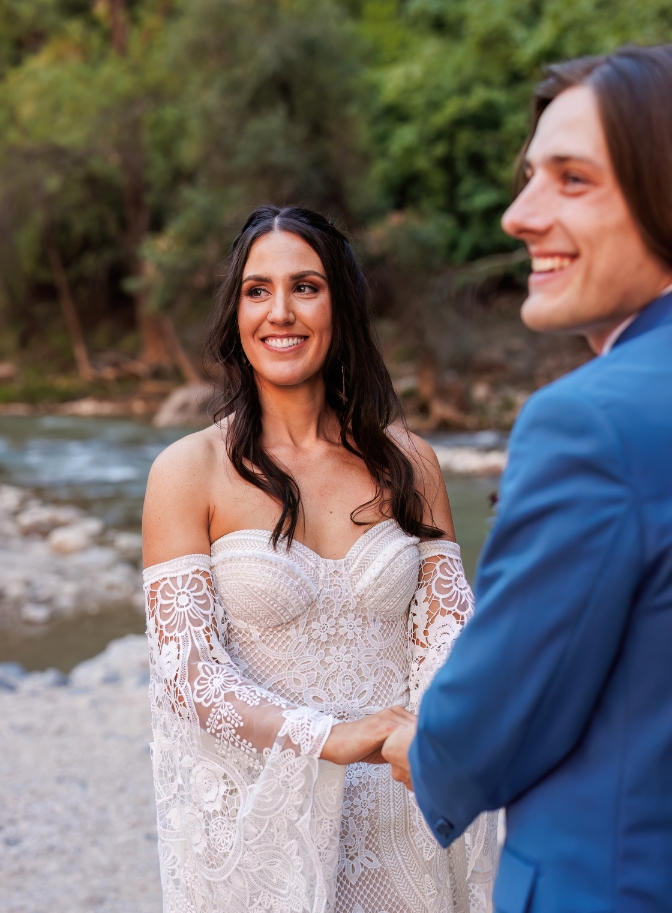 photo of bride and groom smiling and looking off camera