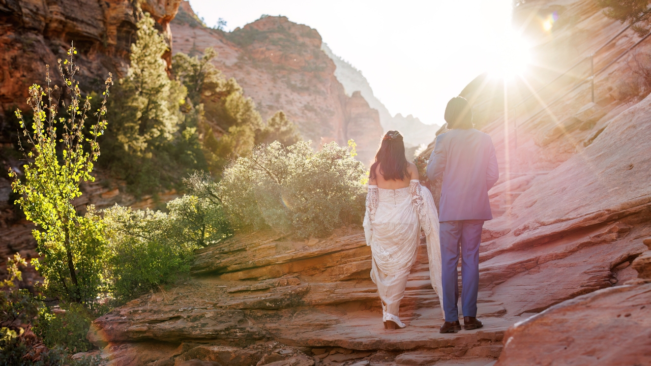 photo of bride and groom hiking in Zion for their wedding day