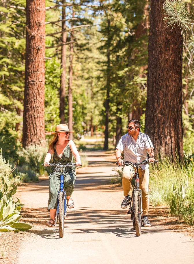 photo of couple bike riding down the street in Lake Tahoe