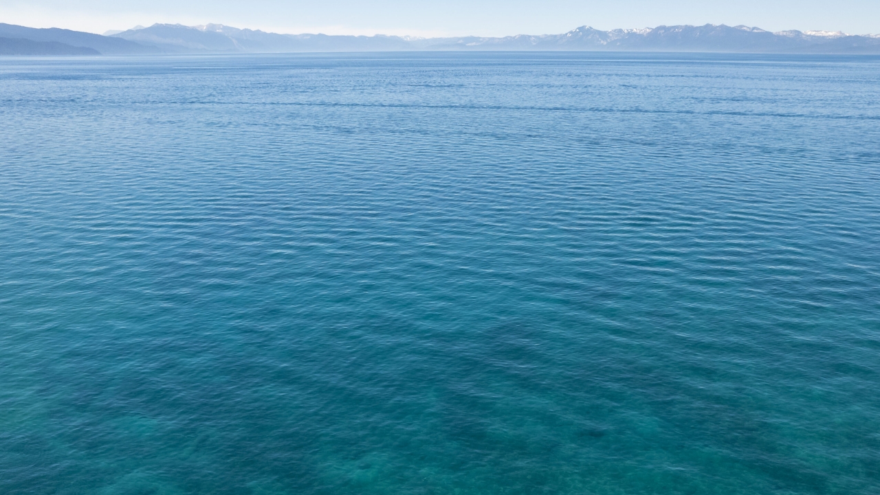 photo of Lake Tahoe with mountains in the distance