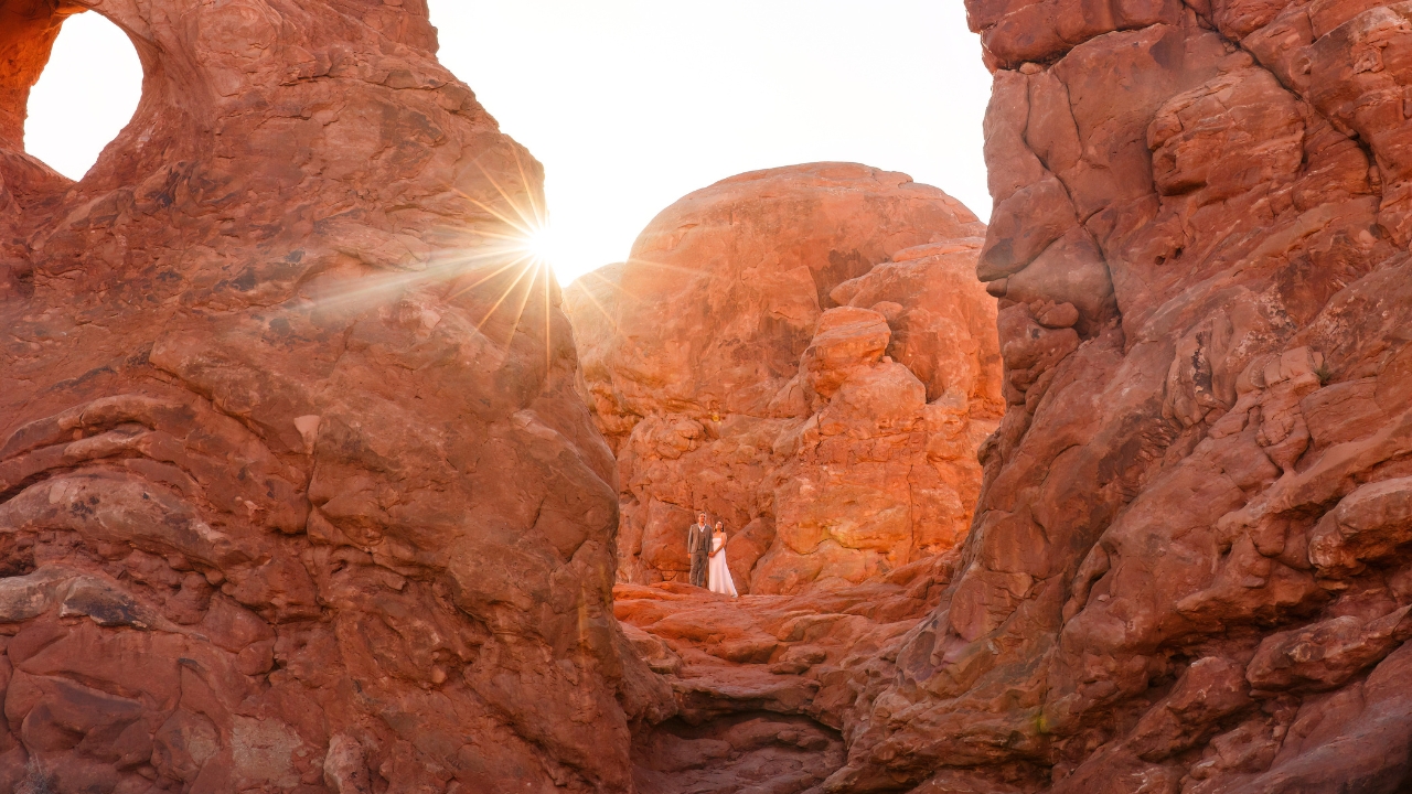 photo of bride and groom surrounded by massive rocks for elopement