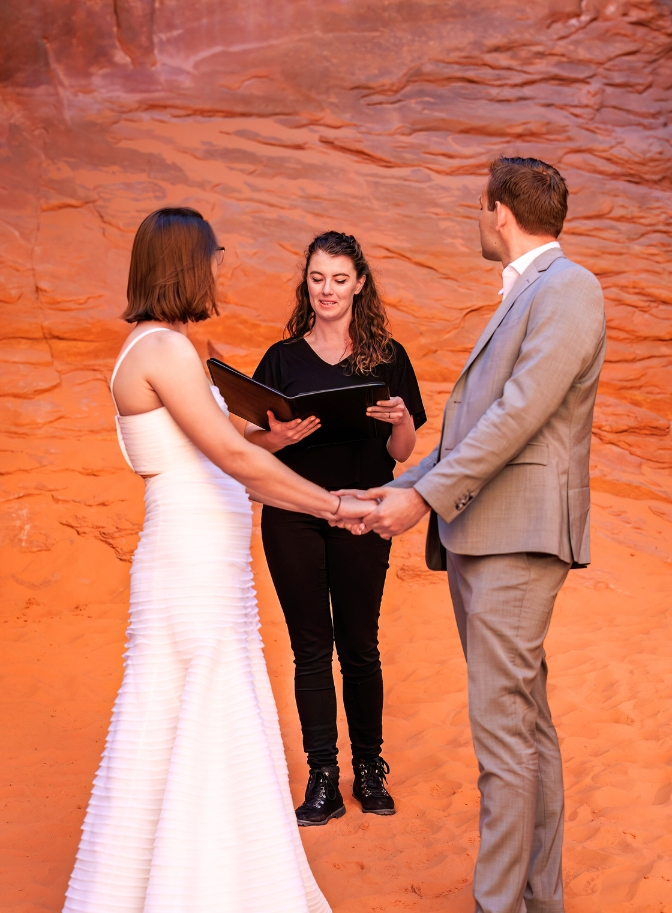 photo of Clarissa Wylde Photography officiating wedding at Arches National Park