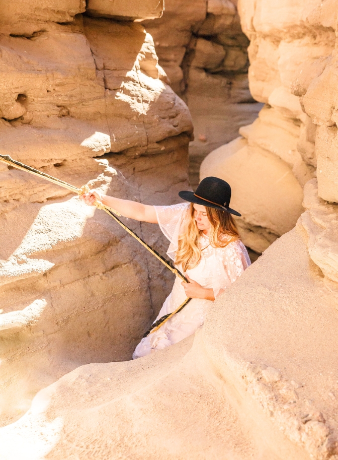 photo of bride rappelling down slot canyon