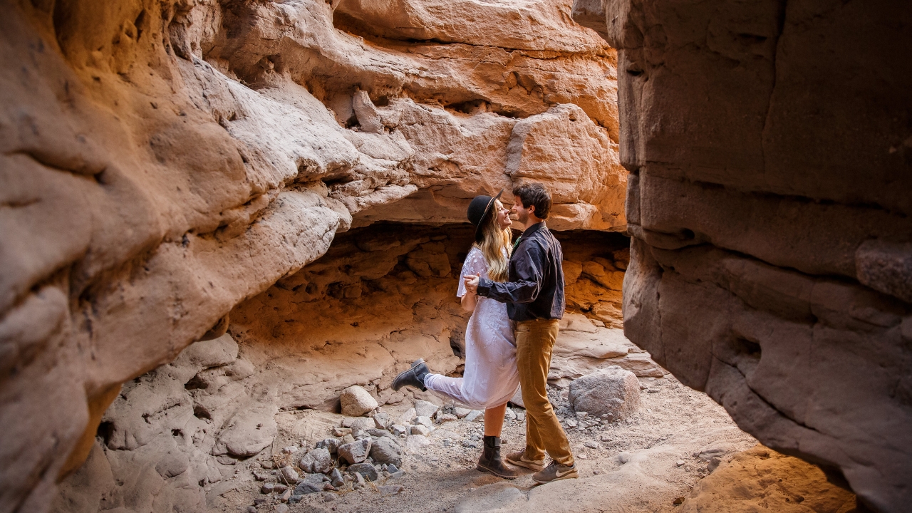 photo of bride and groom dancing in a slot canyon for their elopement