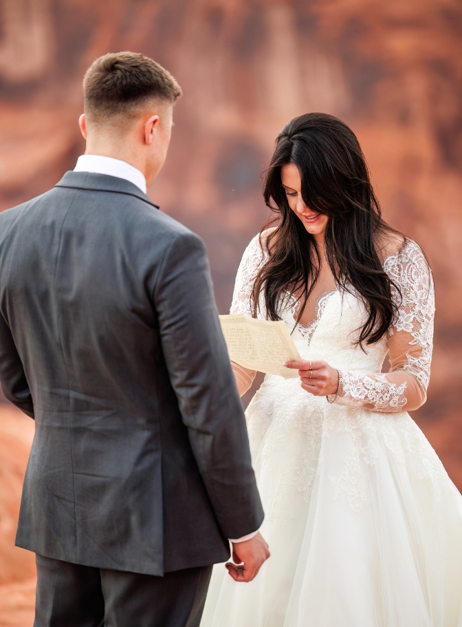 photo of bride reading groom vows