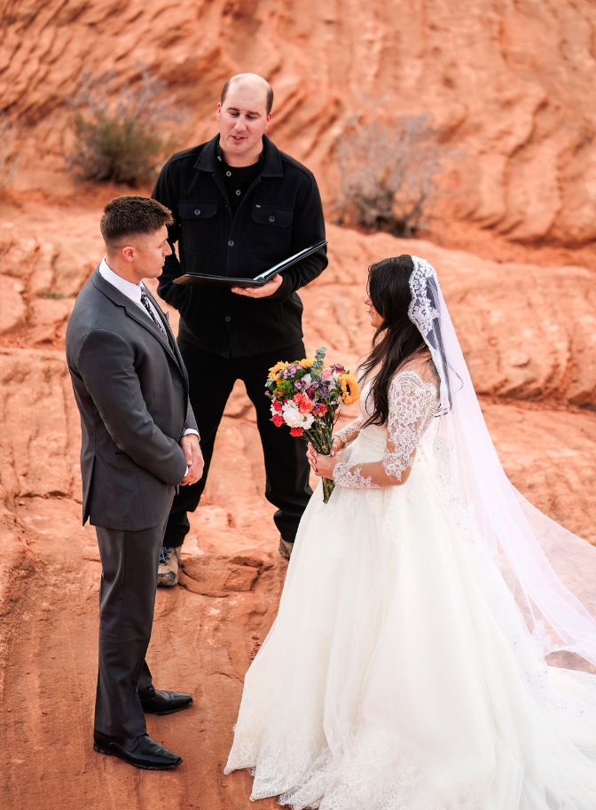 photo of bride and groom exchanging vows at Horseshoe Bend elopement