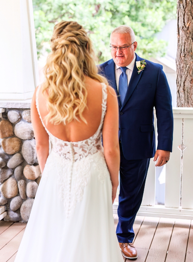 photo of father looking stunned at daughter for first look