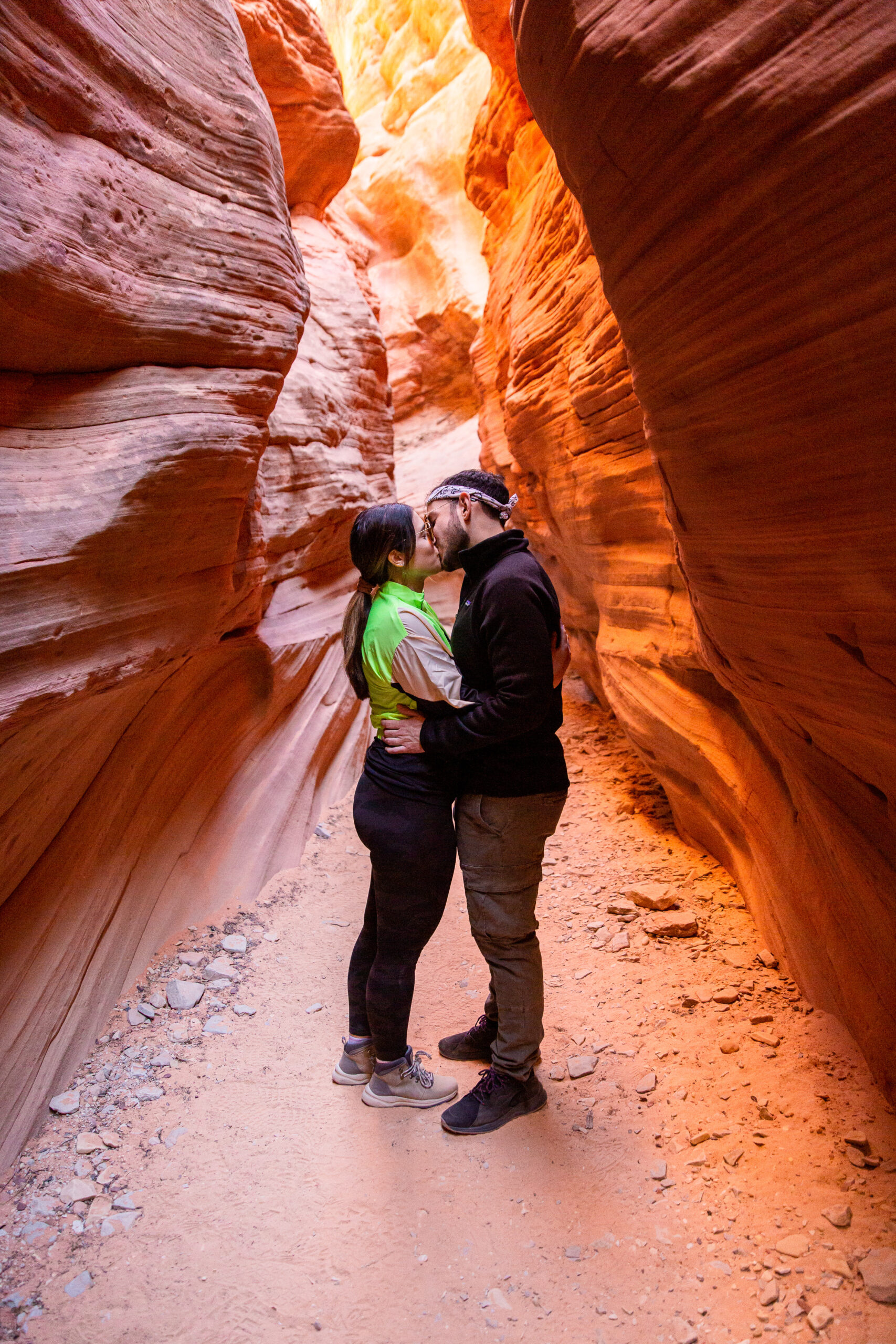 a newly engaged couple kissing in the canyons after the proposal 