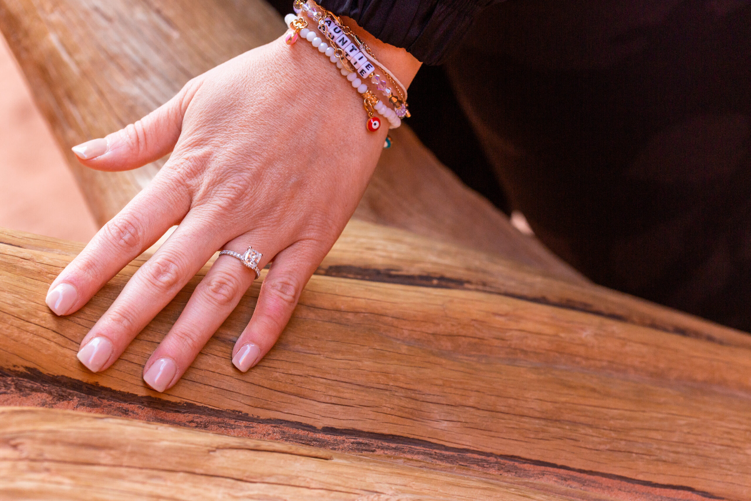 the engagement ring on the woman's hand after the planned proposal 