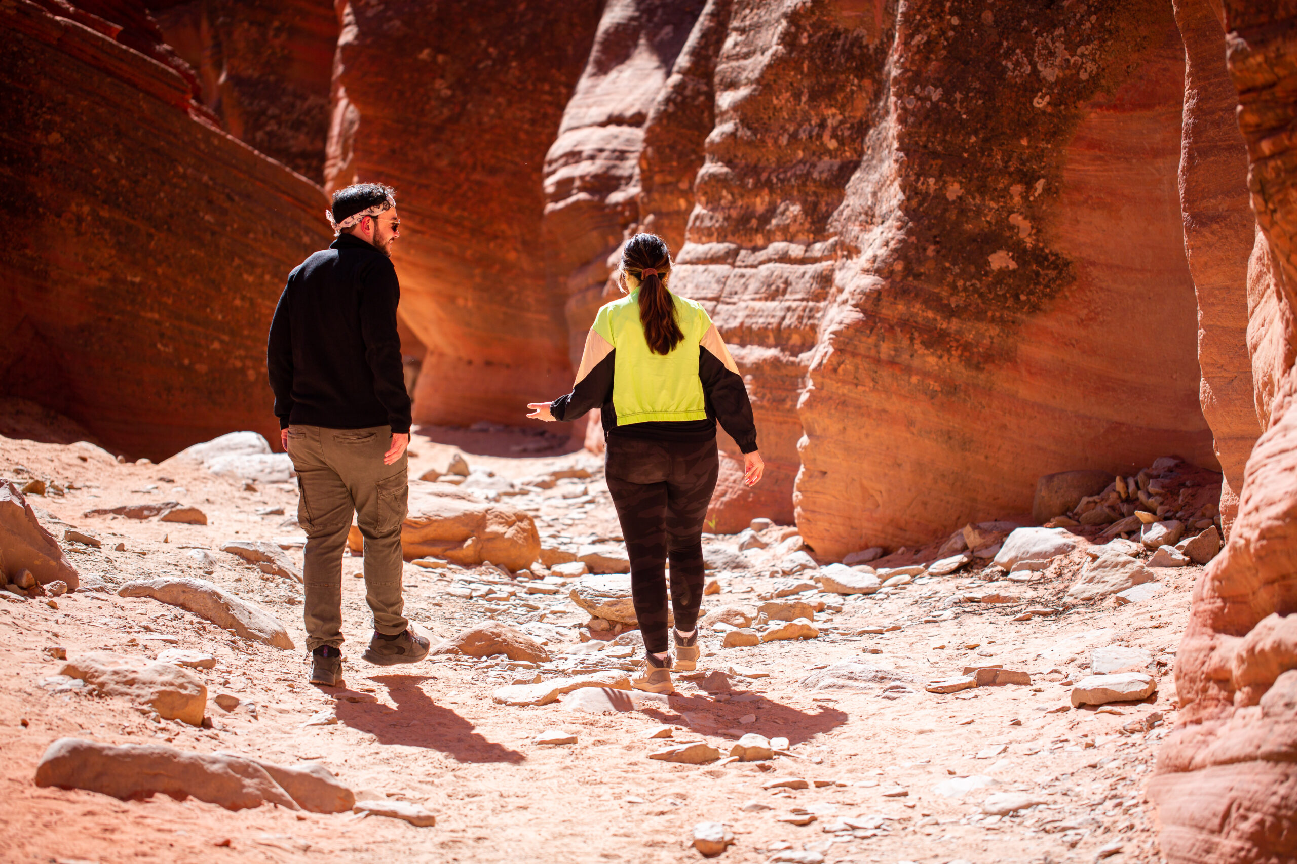 a couple walking to the planned proposal spot in Utah 