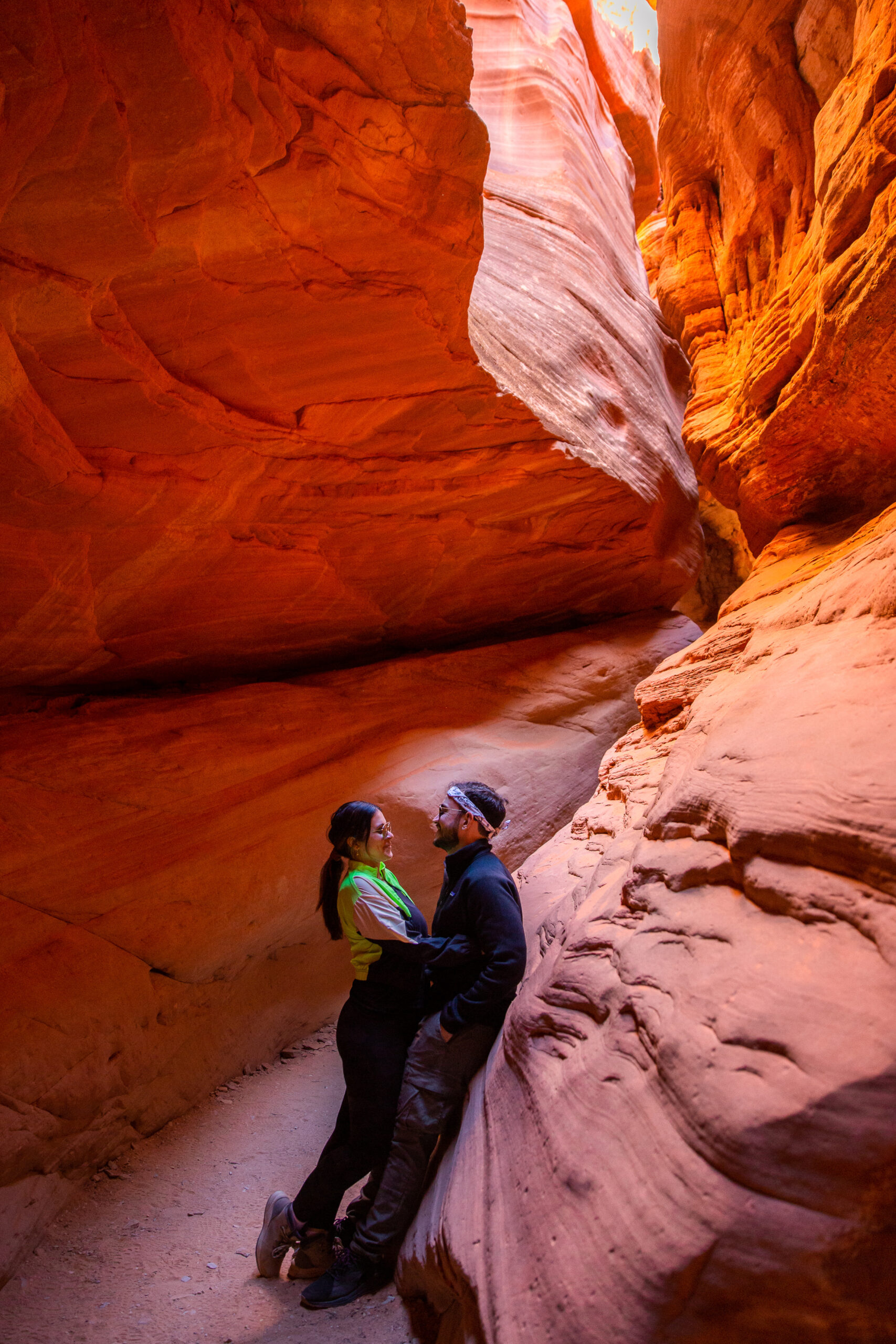 a couple in the red rock canyon holding each other after their proposal