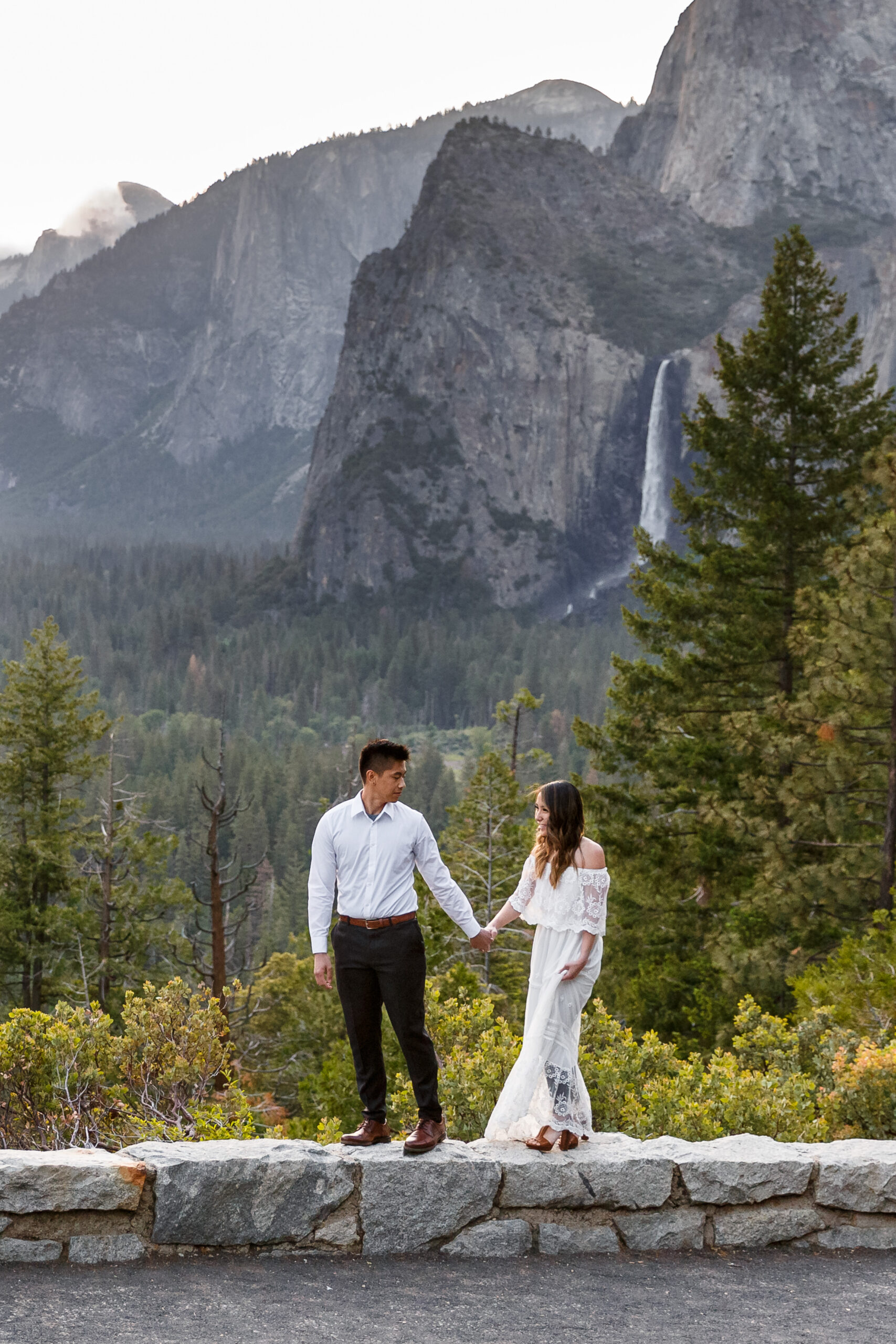 bridal couple in front of a waterfall for their After Wedding Photoshoot