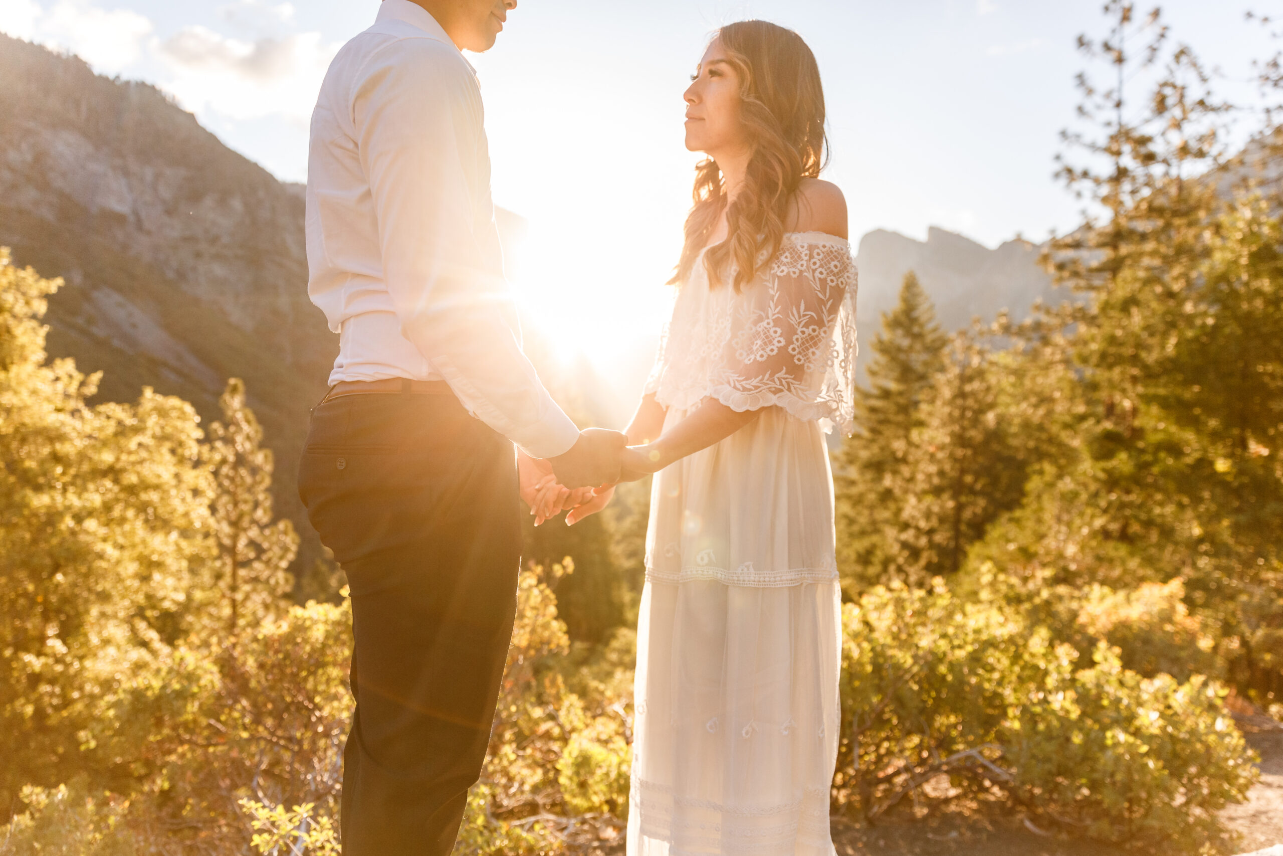 a couple holding hands as the sun rises during their After Wedding Photoshoot