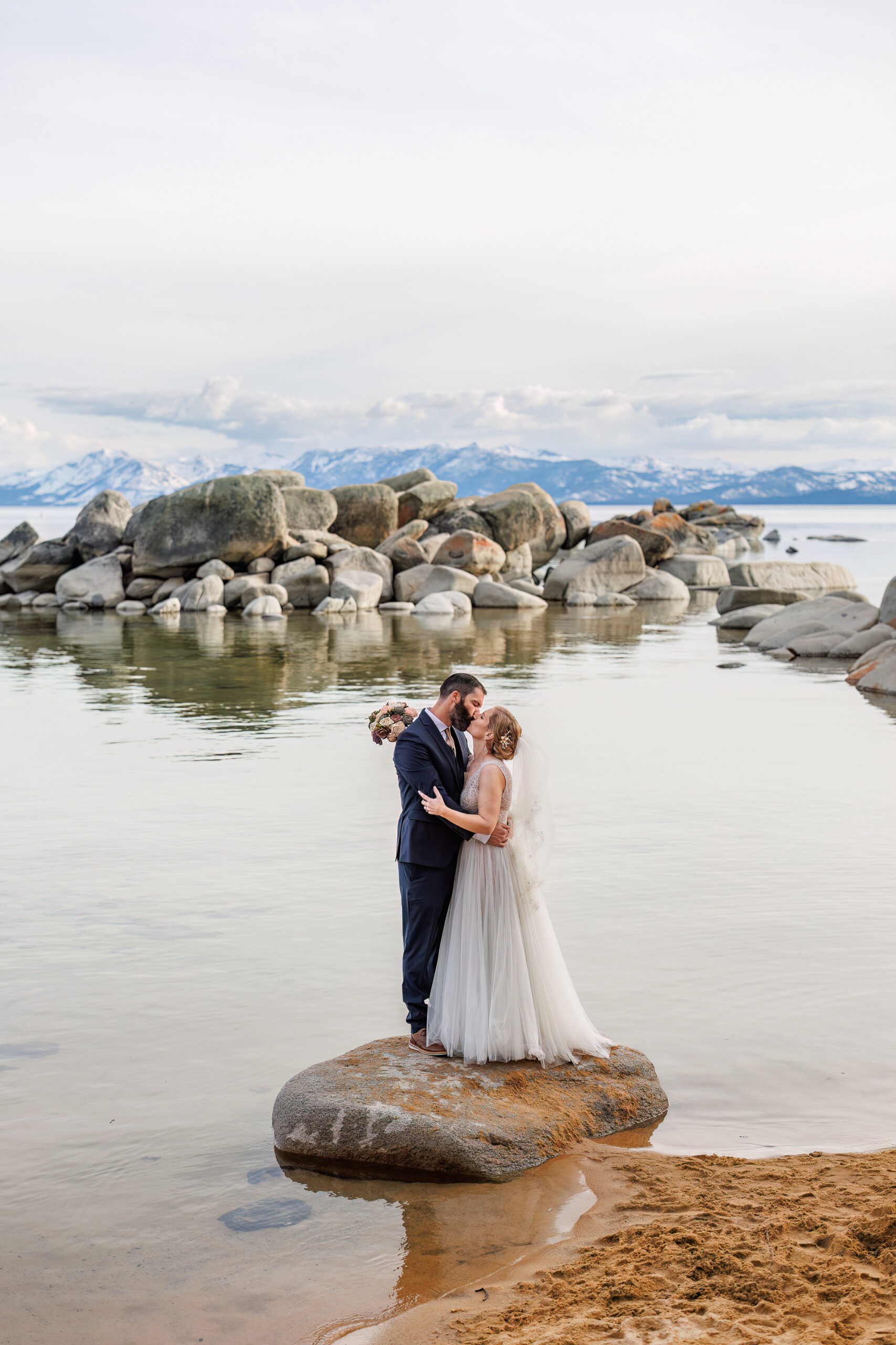 bridal couple portraits by the water in lake Tahoe 