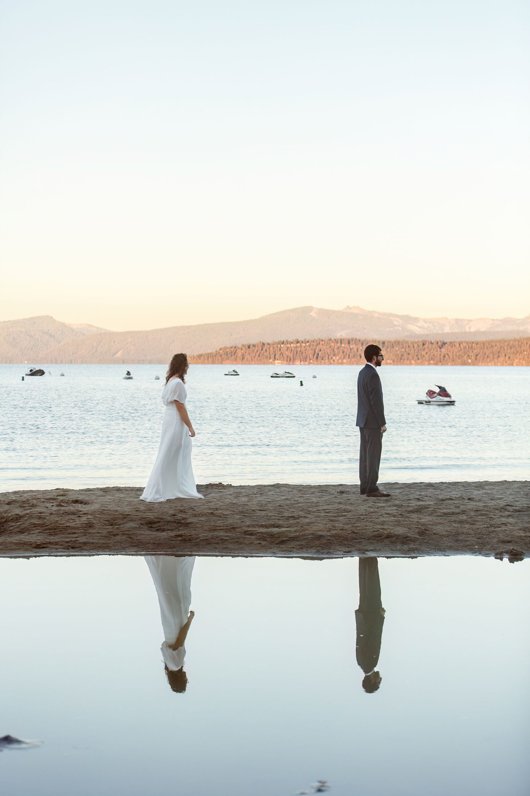 a woman standing behind a man for their first look