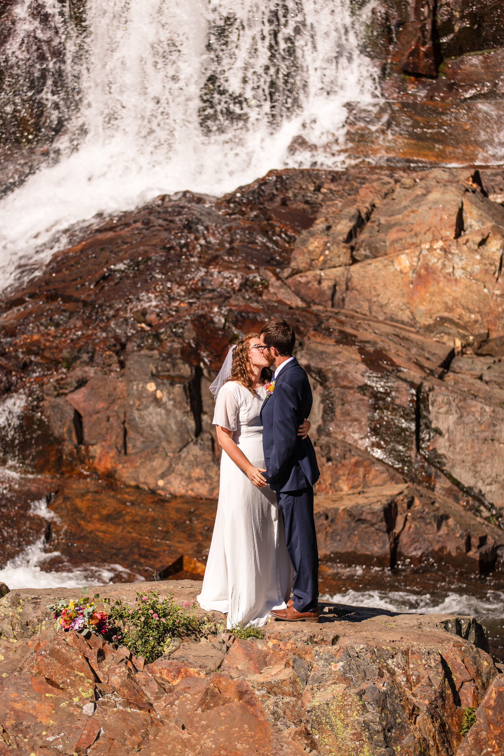 newly weds kissing during their elopement ceremony 