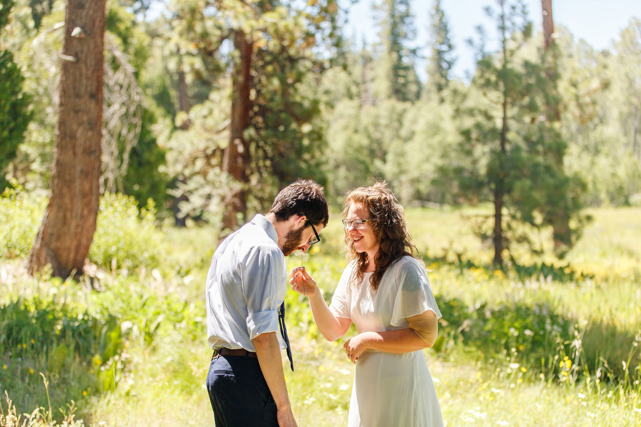 the bride and groom laughing together before their picnic Elopement Activity 