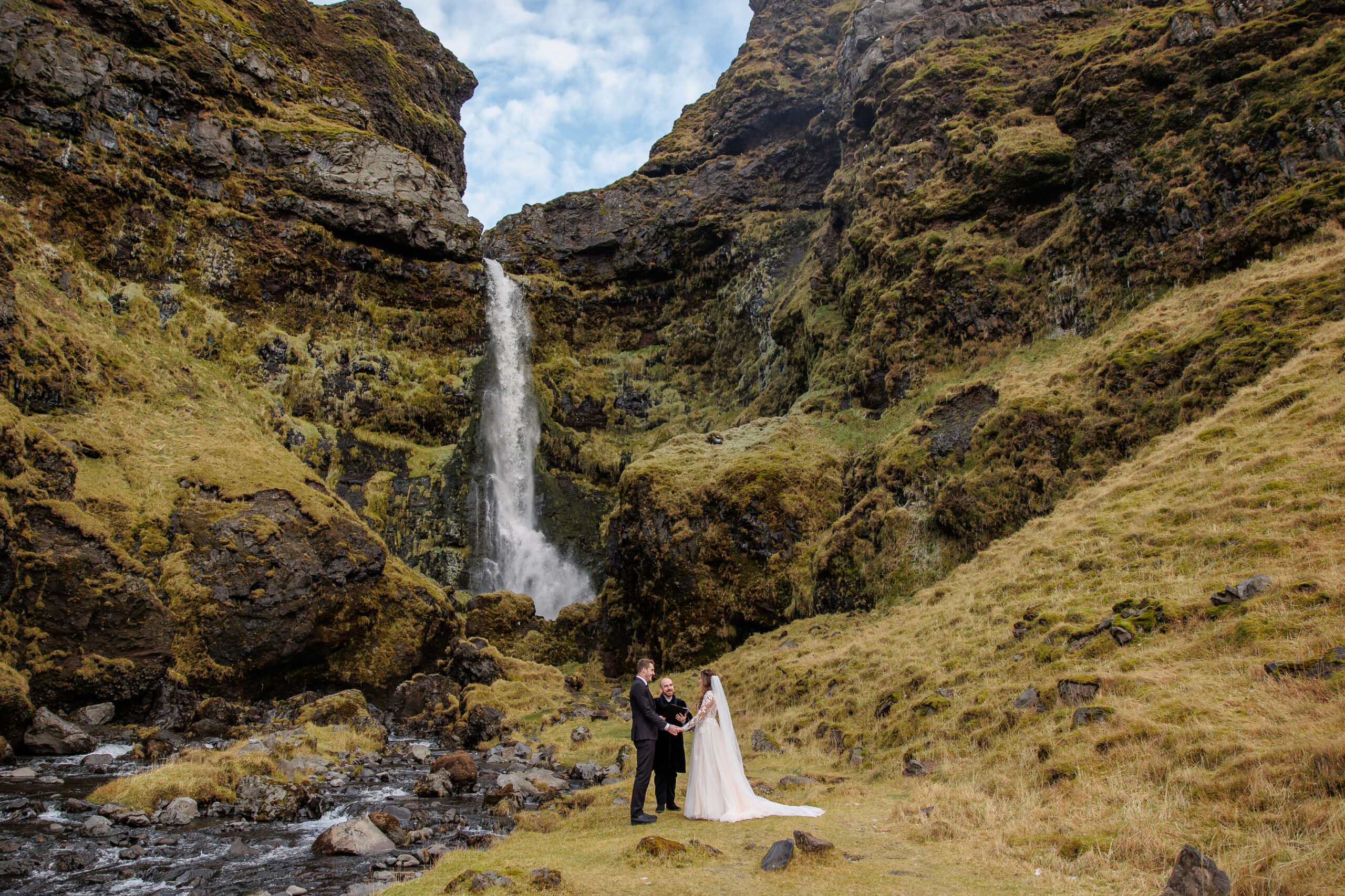 a winter elopement waterfall ceremony 