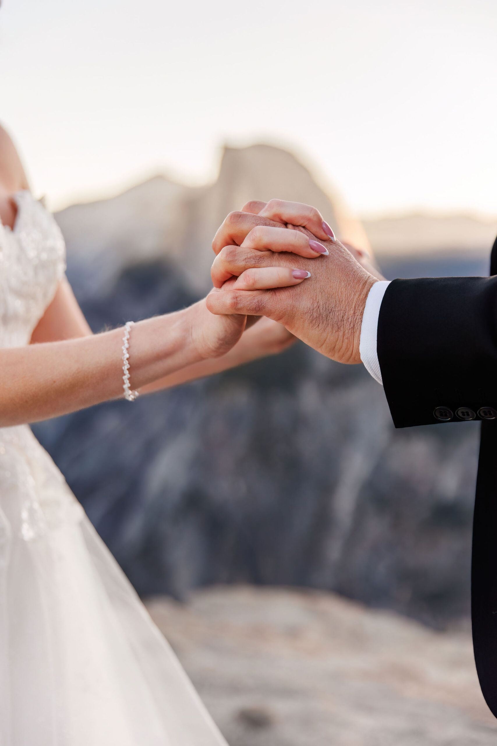 bride and groom holding hands 