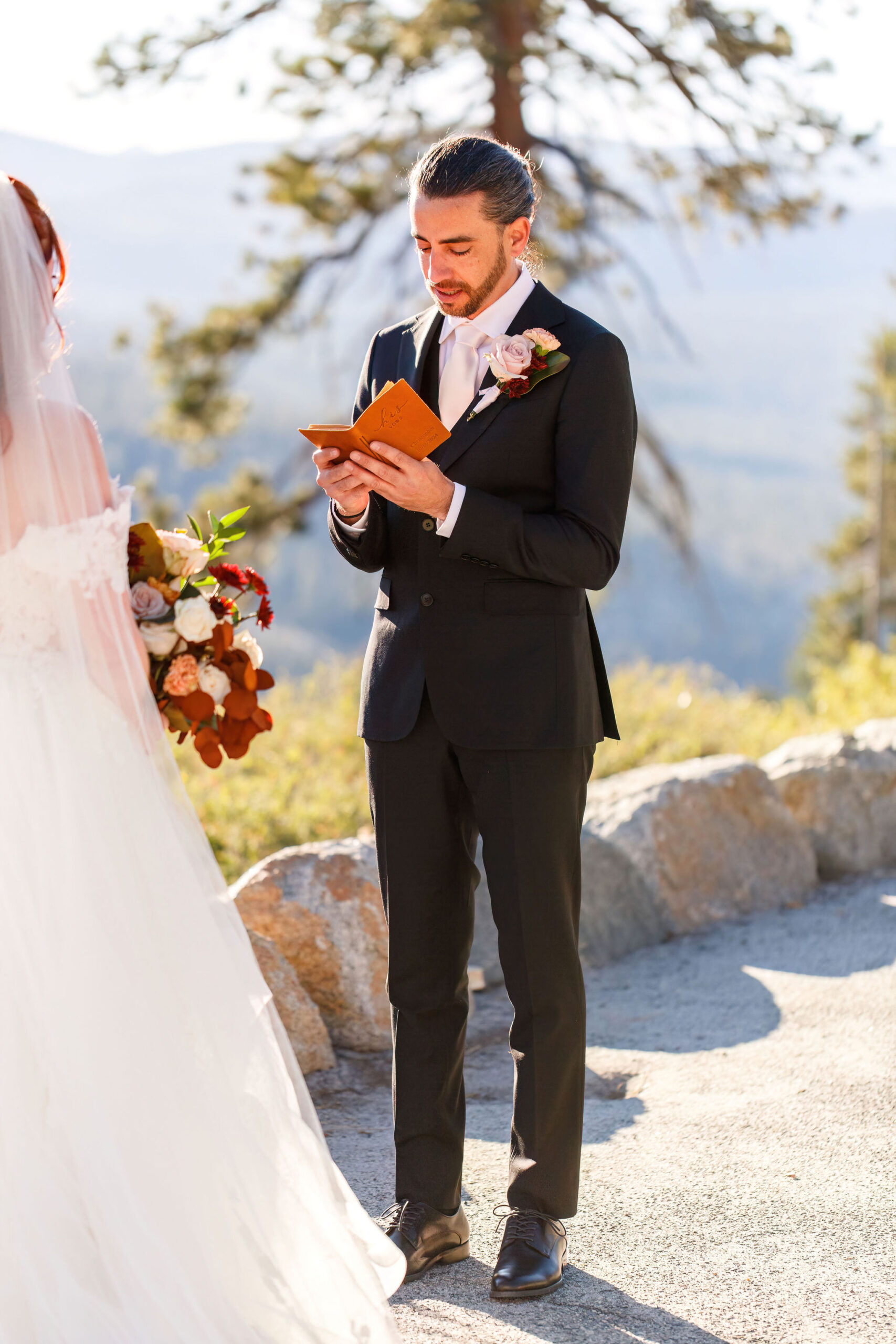 groom reading his vows during their Yosemite elopement