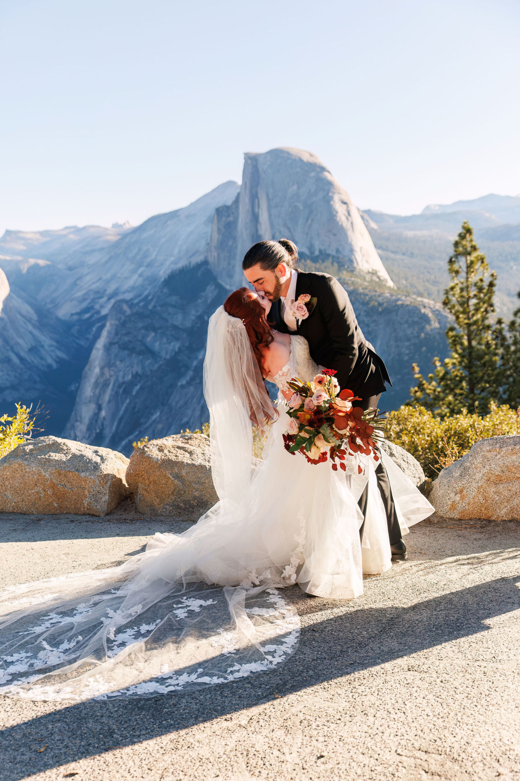 bride and groom kissing after their Yosemite elopement ceremony 