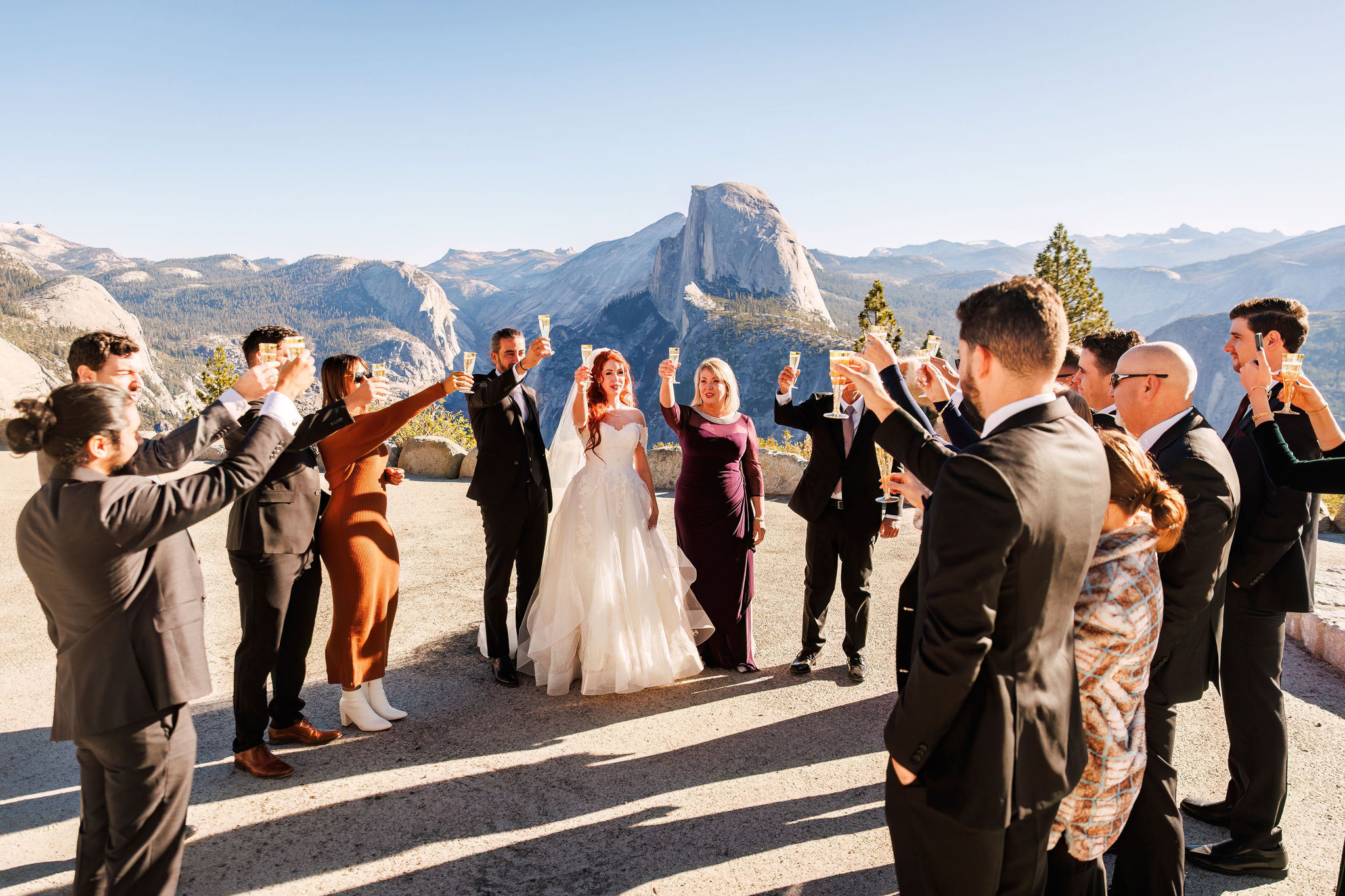 bridal couple toasting with their guests 