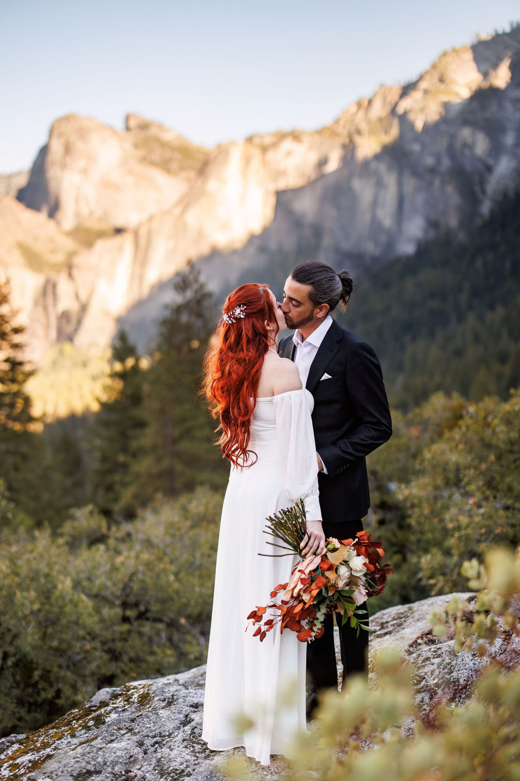 bride and groom kissing during their fall elopement 