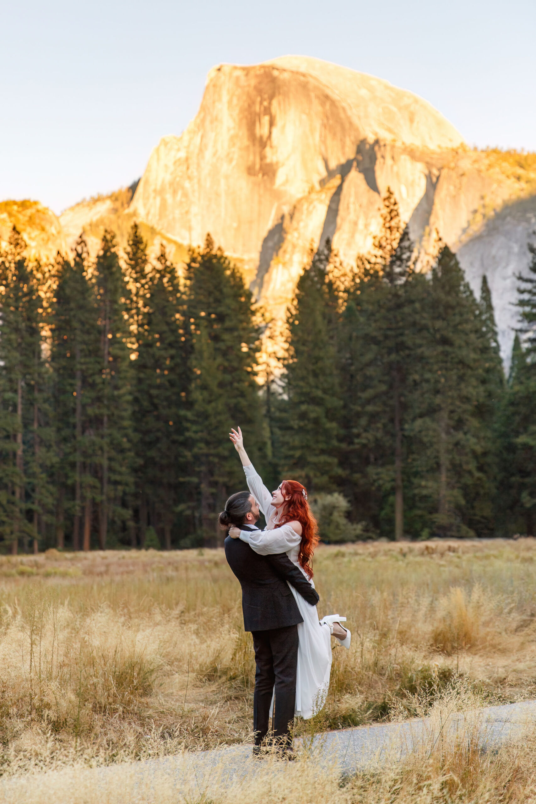 groom holding the bride for Yosemite elopement photos 