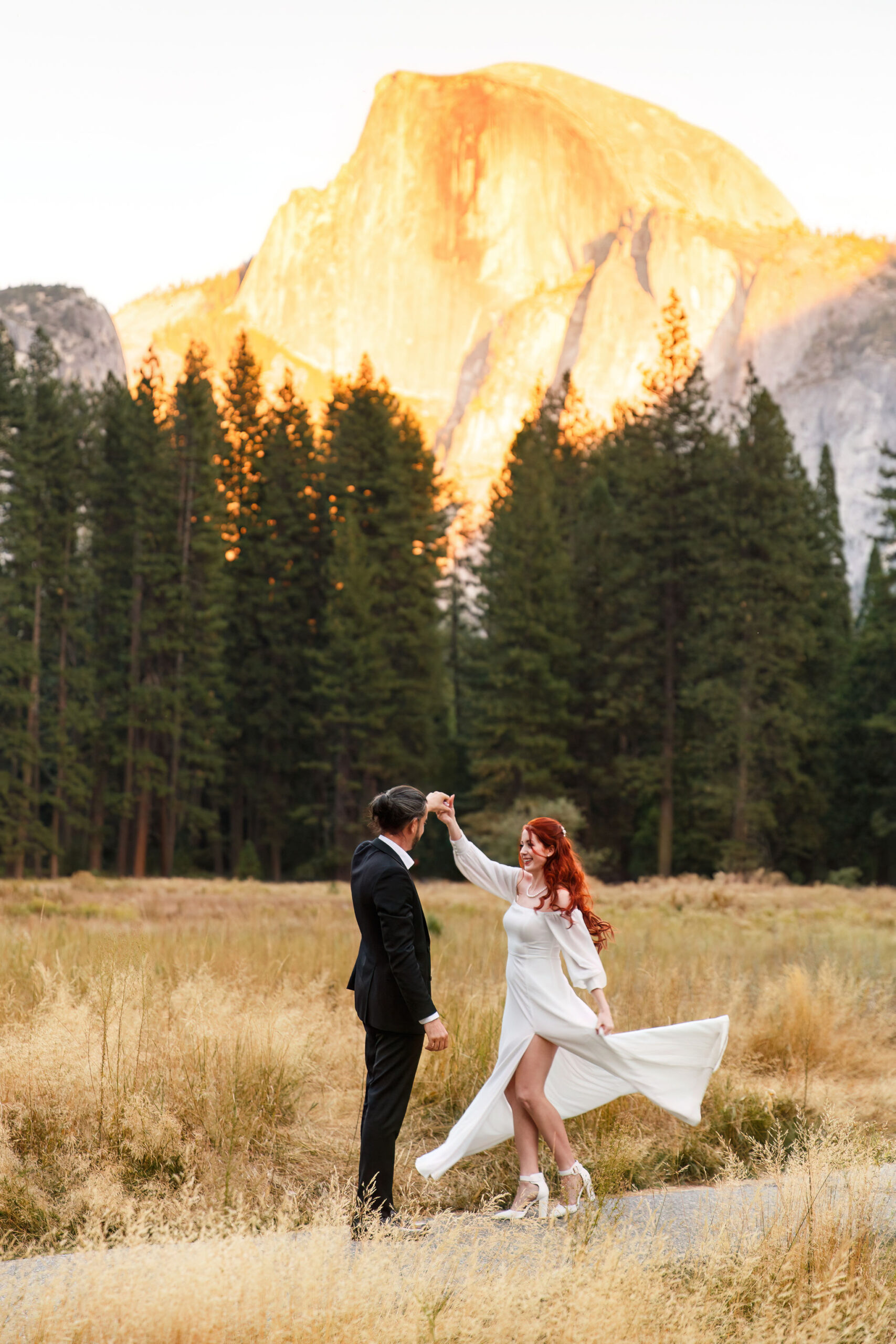 bride and groom dancing in Yosemite