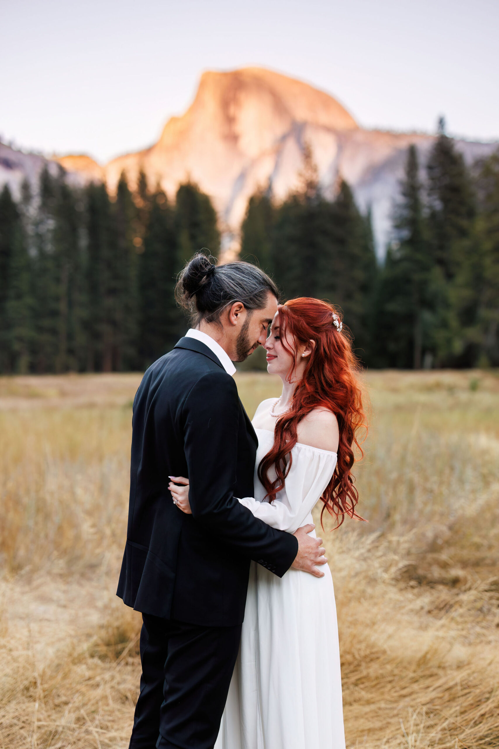 bride and groom in a meadow for Yosemite elopement photos 