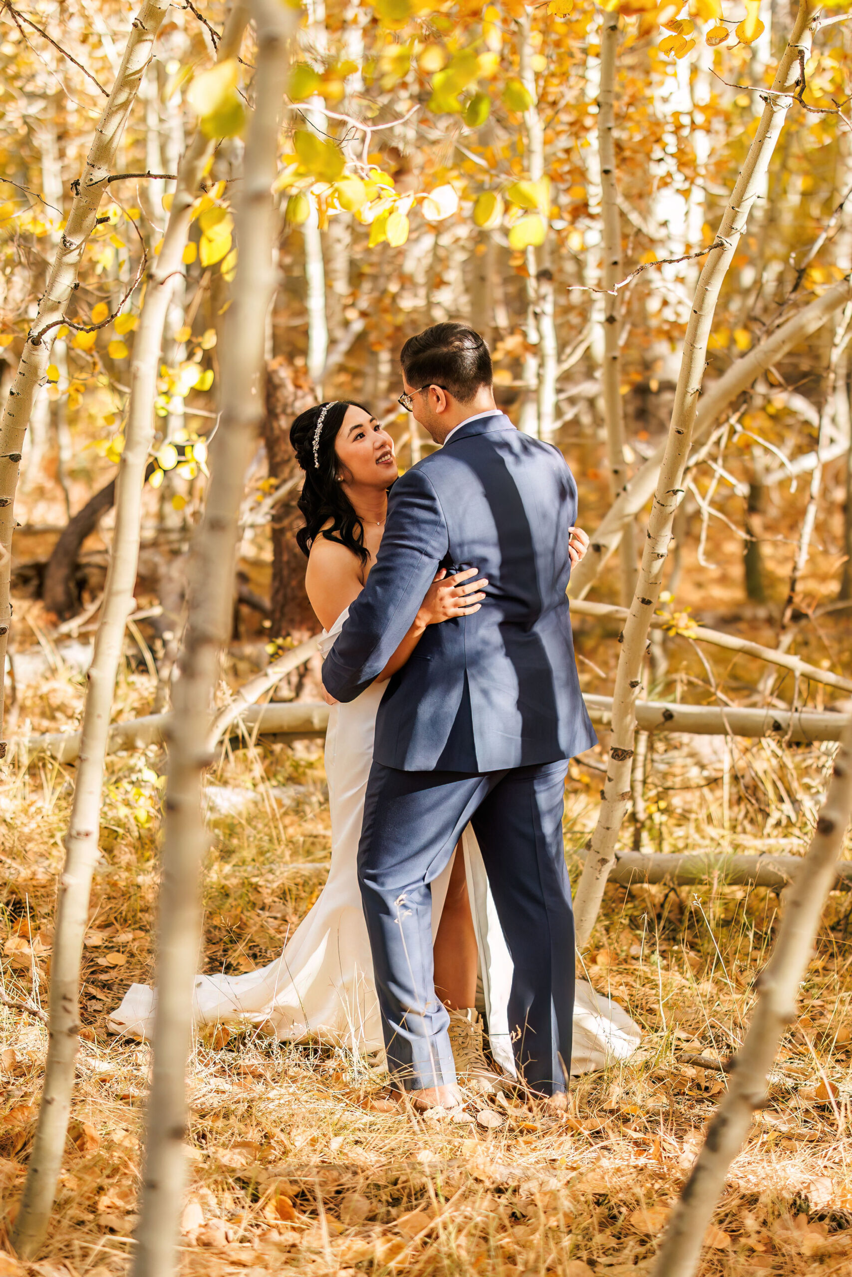 bride and groom among the aspen trees