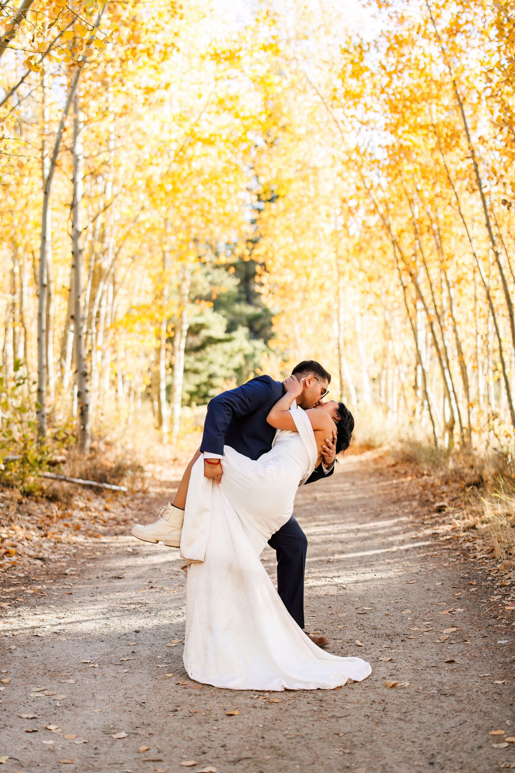 groom dipping and kissing the bride