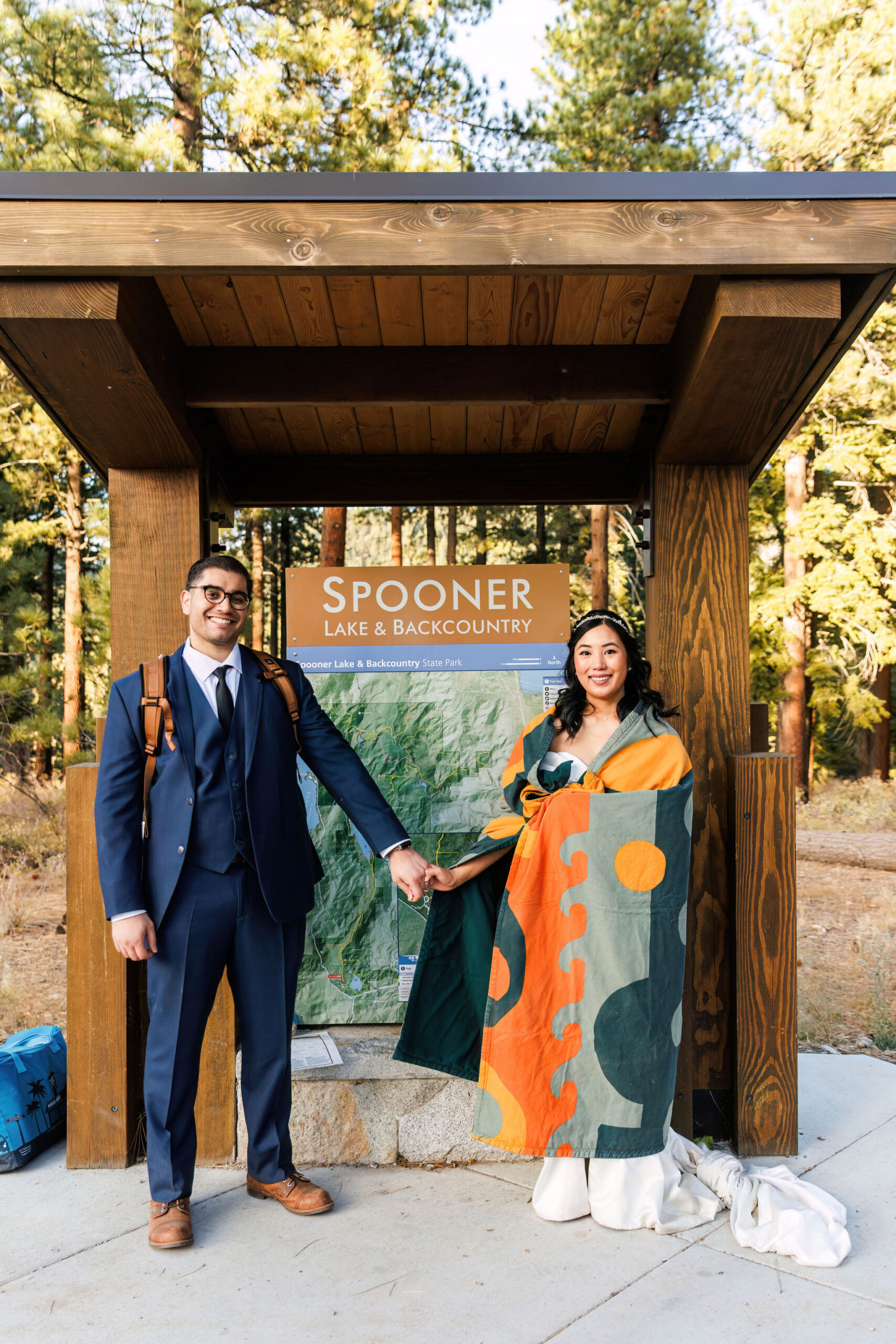 bride and groom next to the trail sign for their Elopement in Lake Tahoe