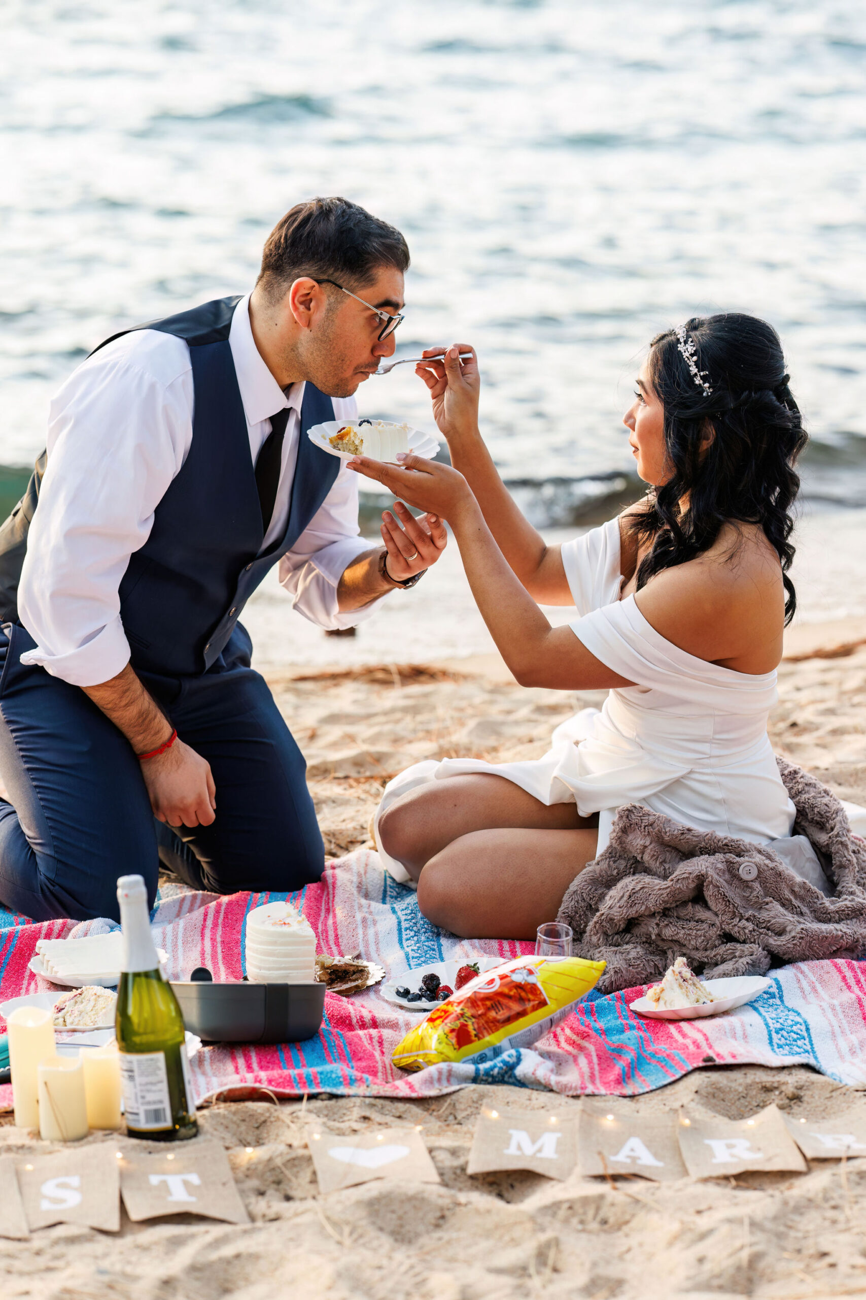 bride and groom eating cake for their Elopement in Lake Tahoe 