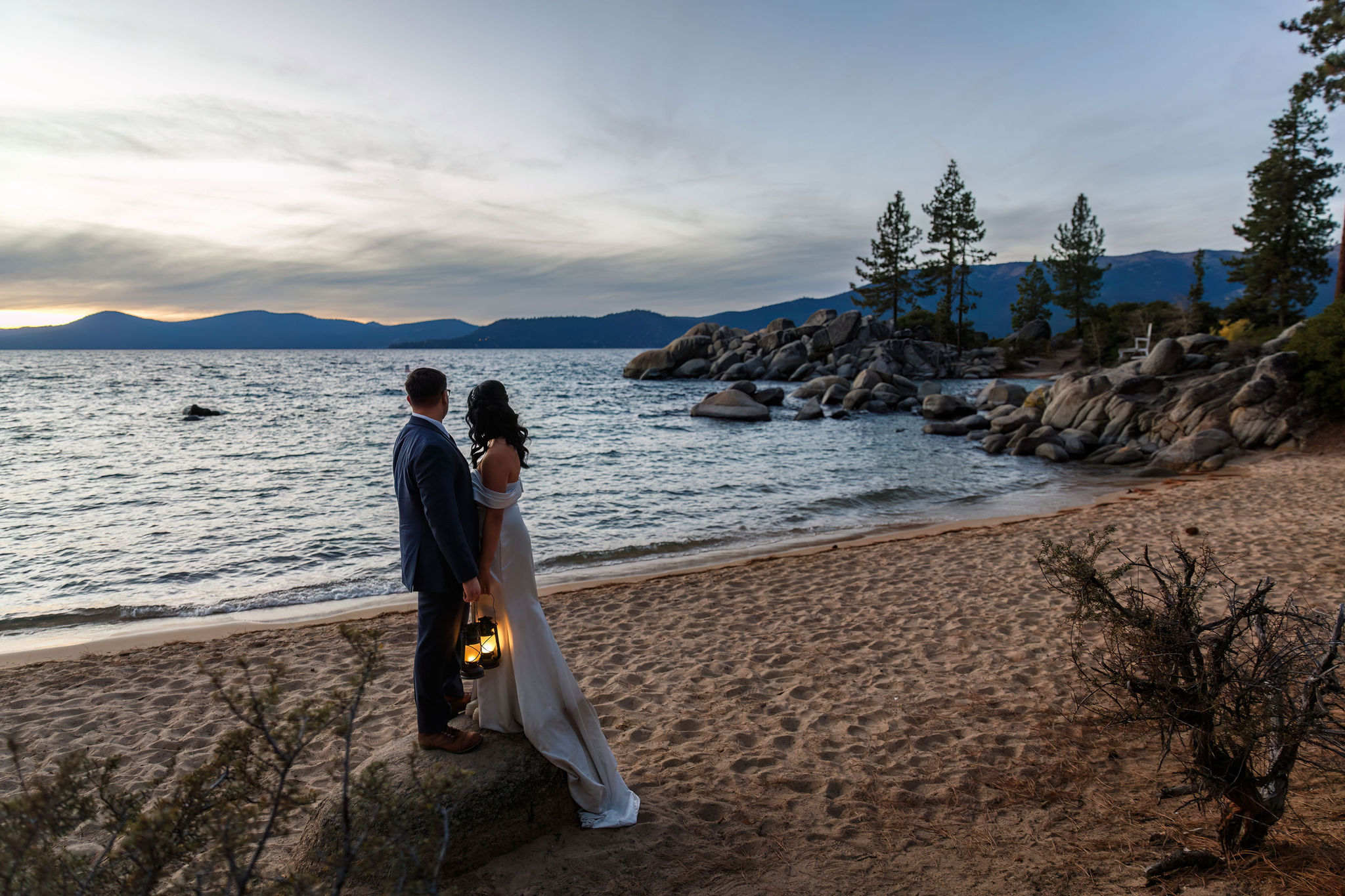 bride and groom standing on a rock during their Elopement in Lake Tahoe