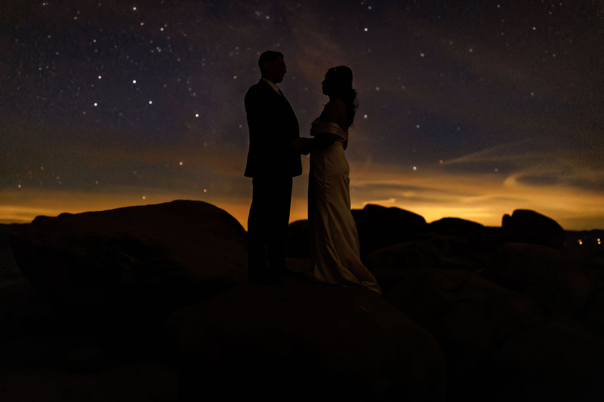 bridal couple standing together with the stars above them 