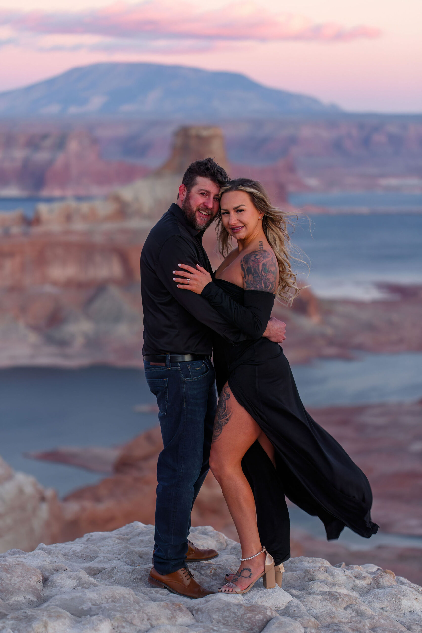 newly engaged couple posing and smiling for their Utah engagement photos