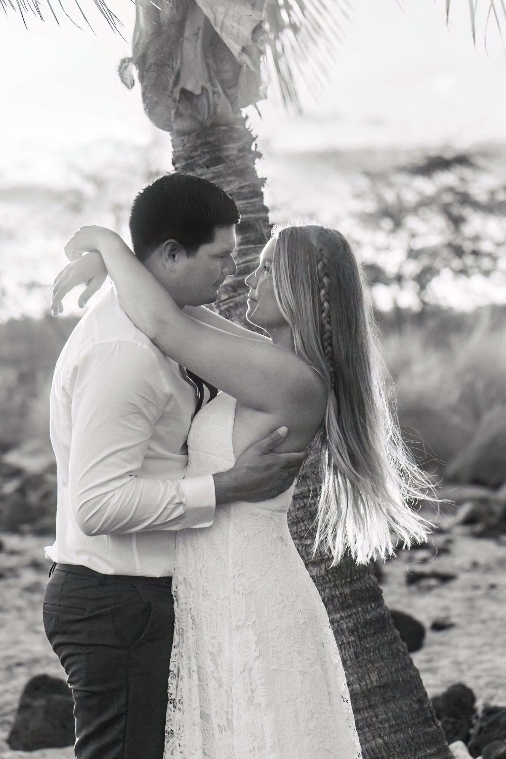 a couple holding and looking at each other during their Hawaii elopement 