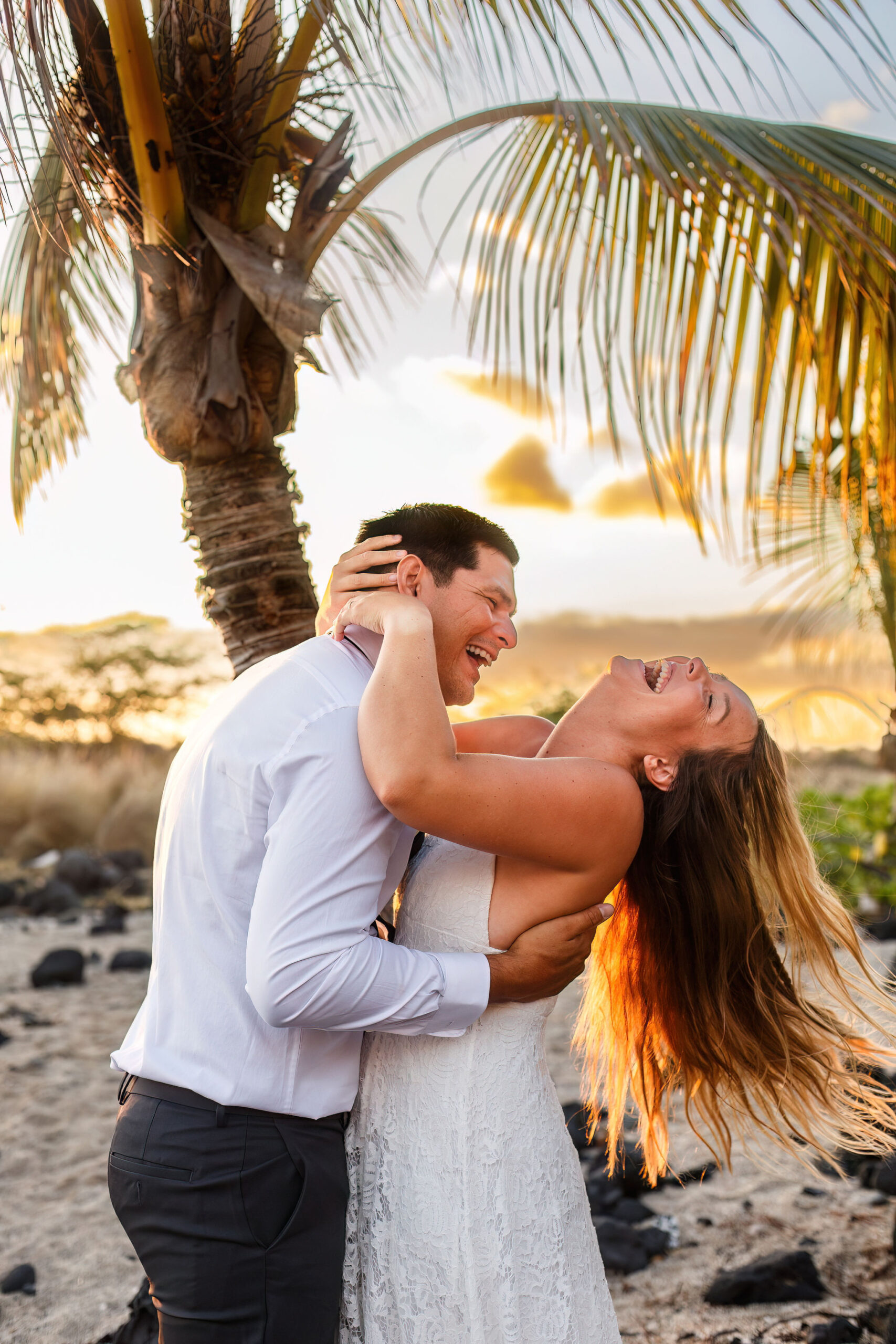 a couple laughing hard together at their Hawaii elopement 